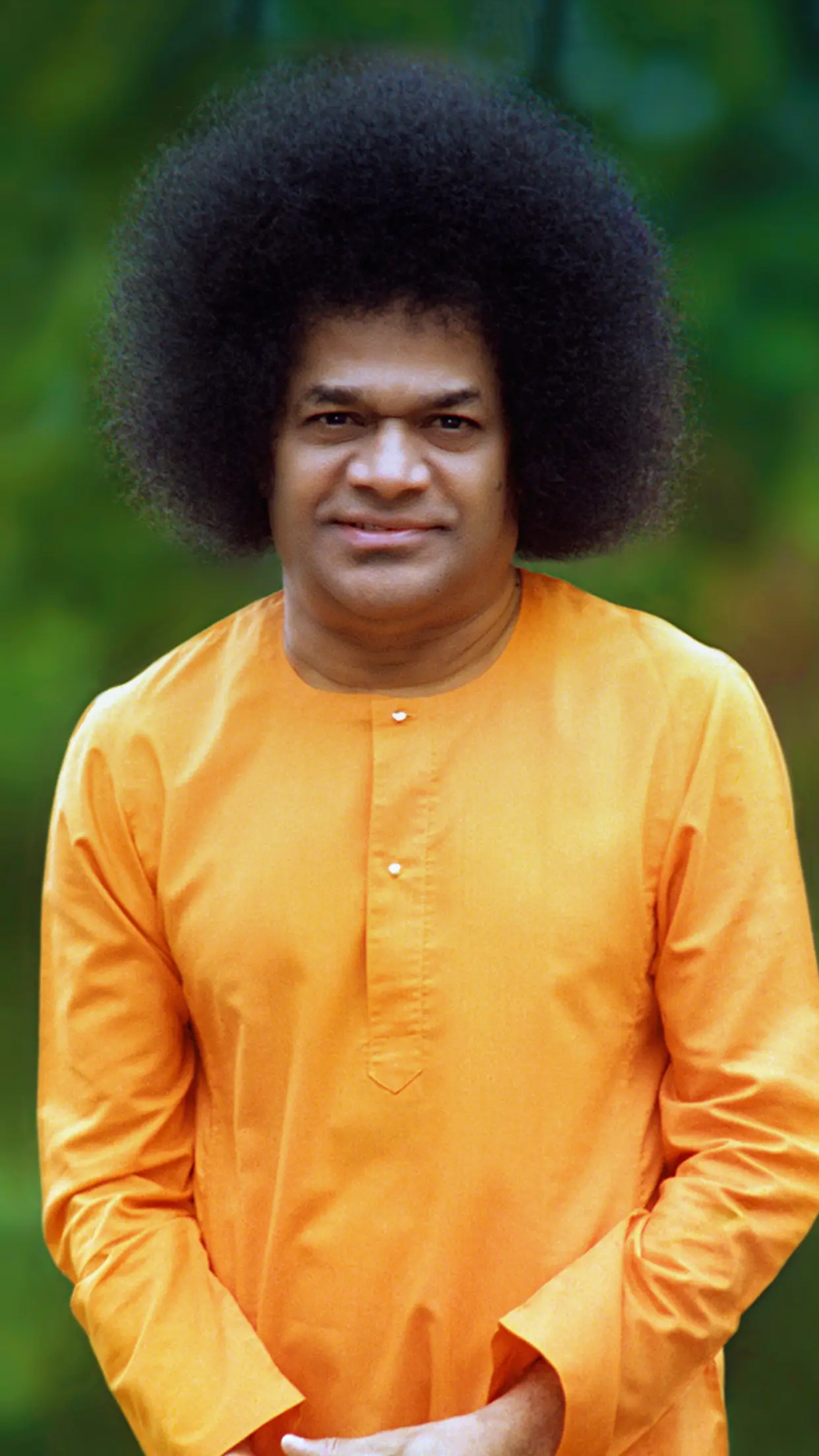 Bhagawan Sri Sathya Sai Baba standing with folded hands